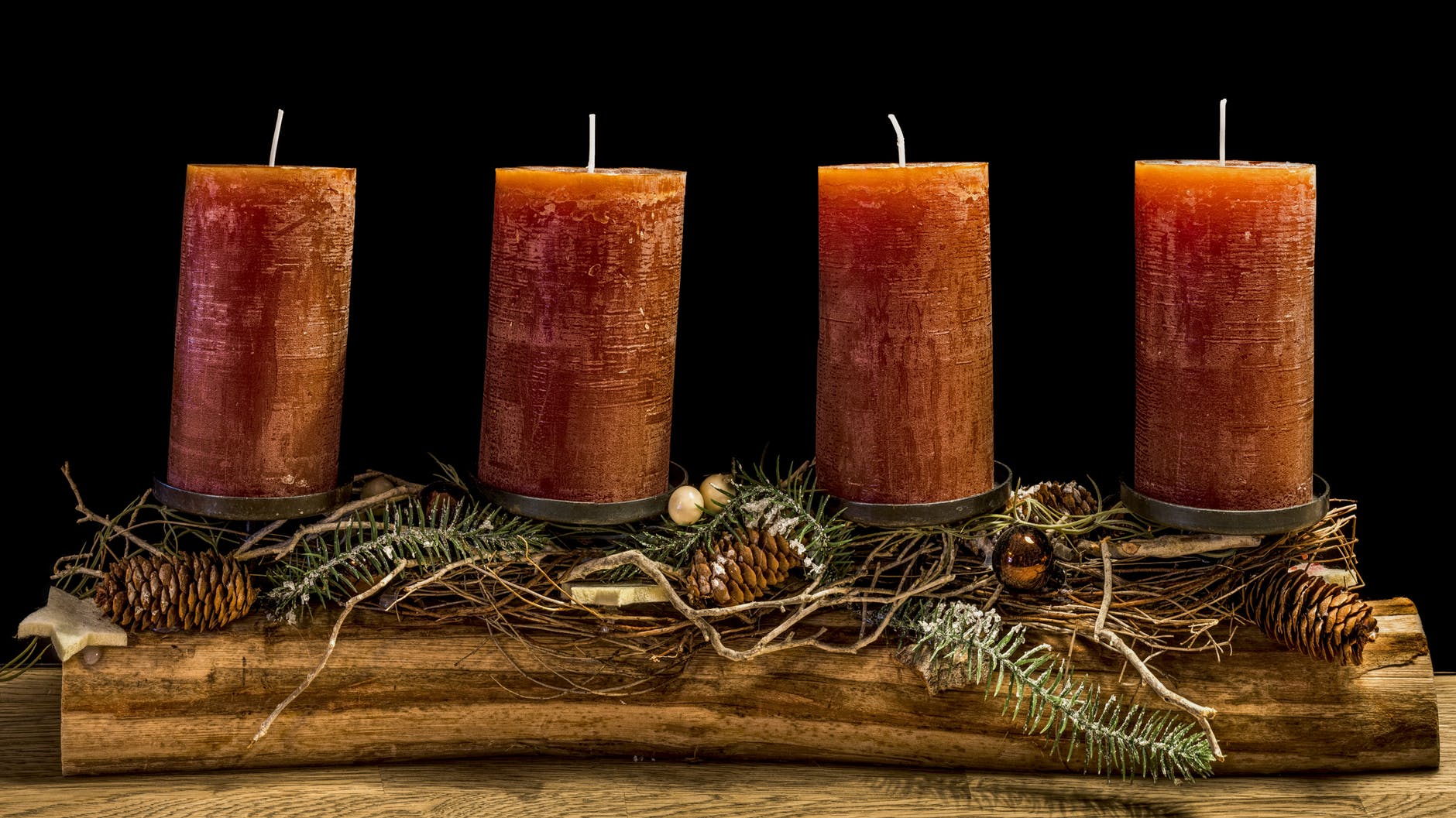 four brown wax candles