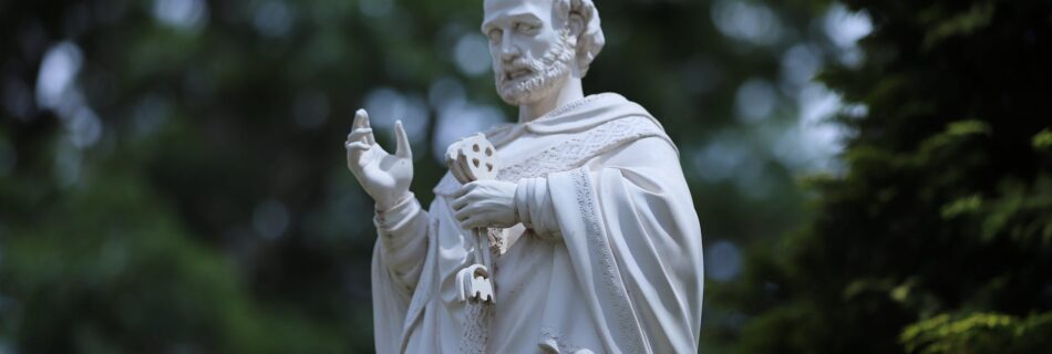 white concrete statue of a man