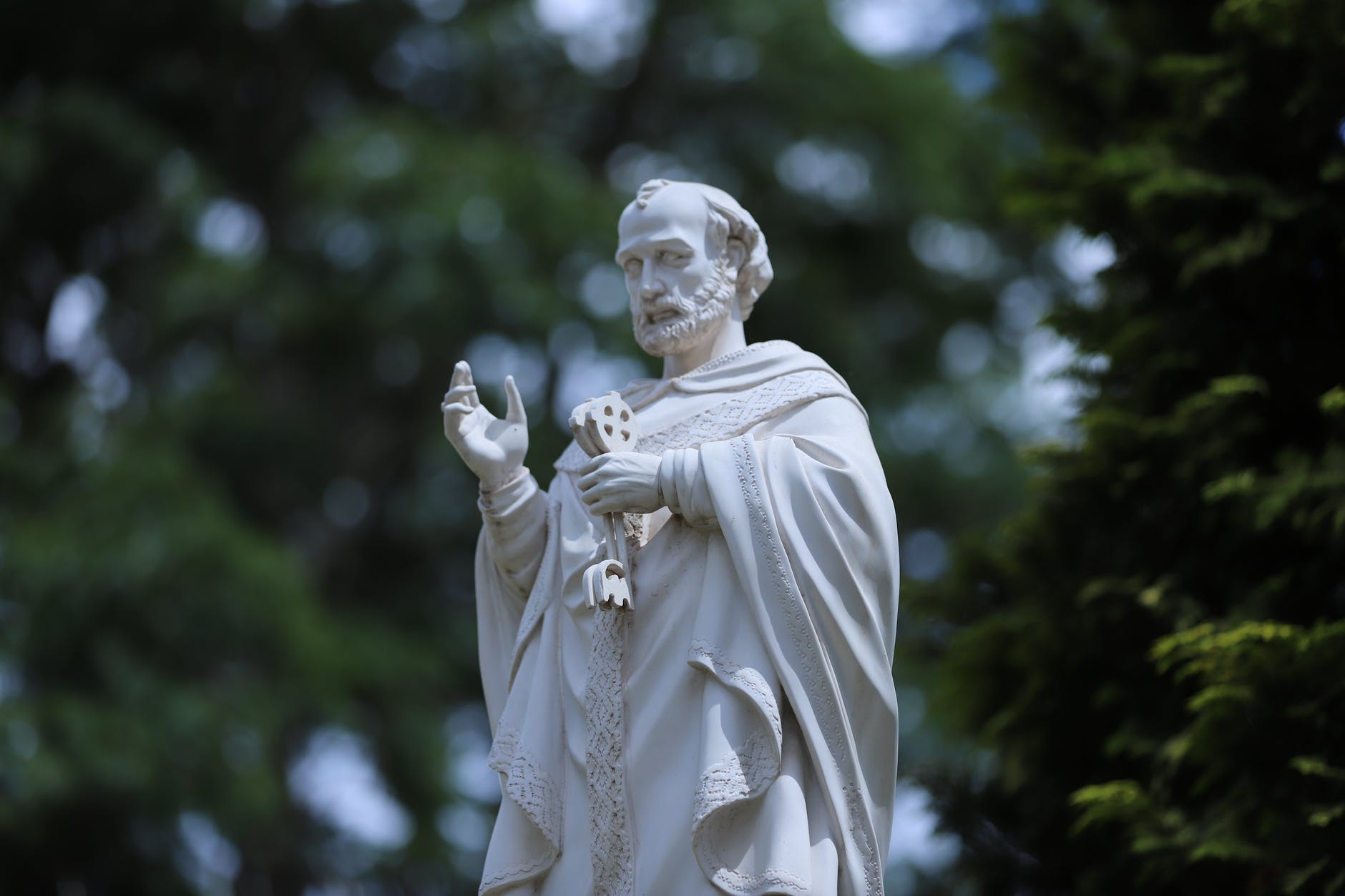 white concrete statue of a man